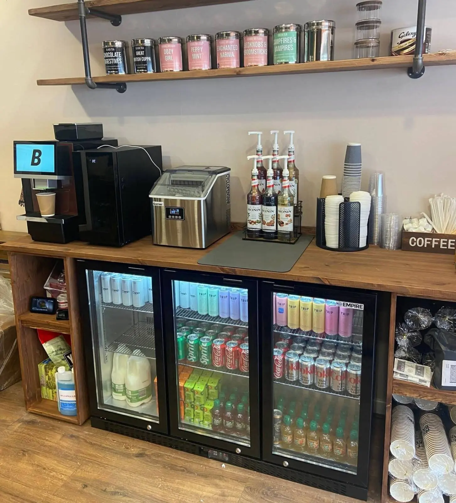 Chapter 13 coffee station with syrups, teas, cups and chilled drinks.